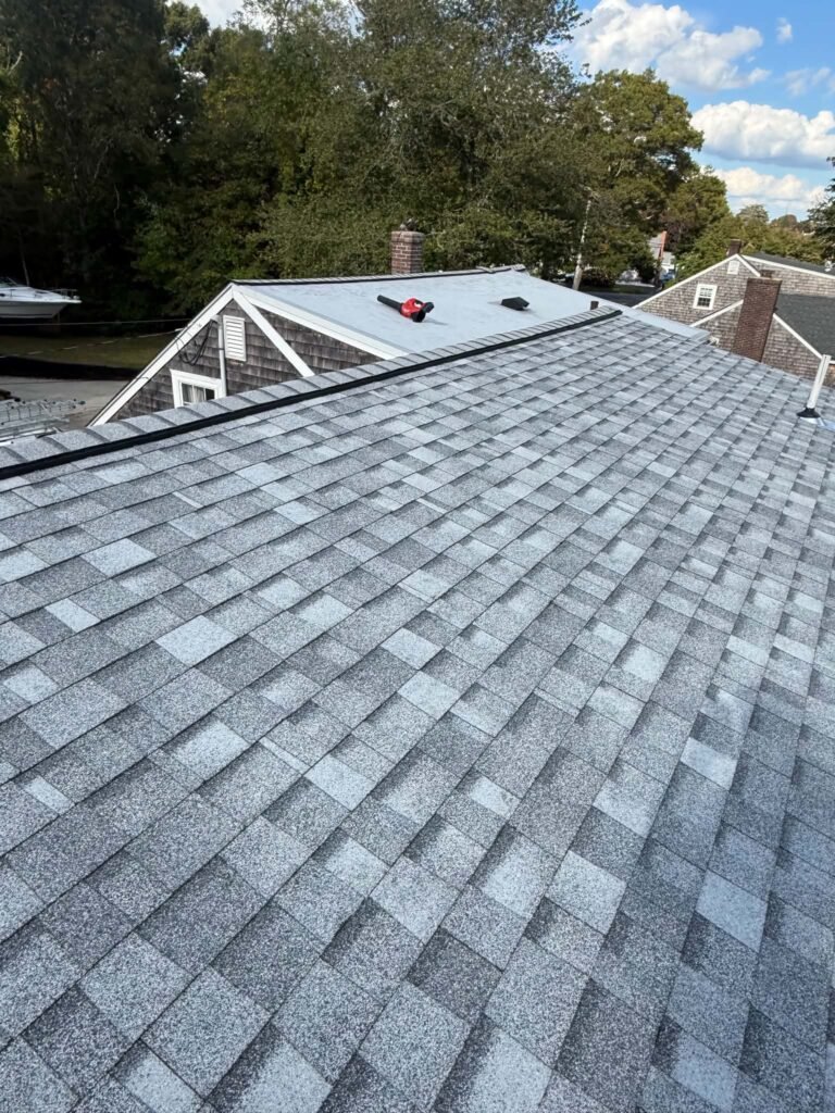 New gray asphalt shingle roof installed by Daniela's Construction in Massachusetts