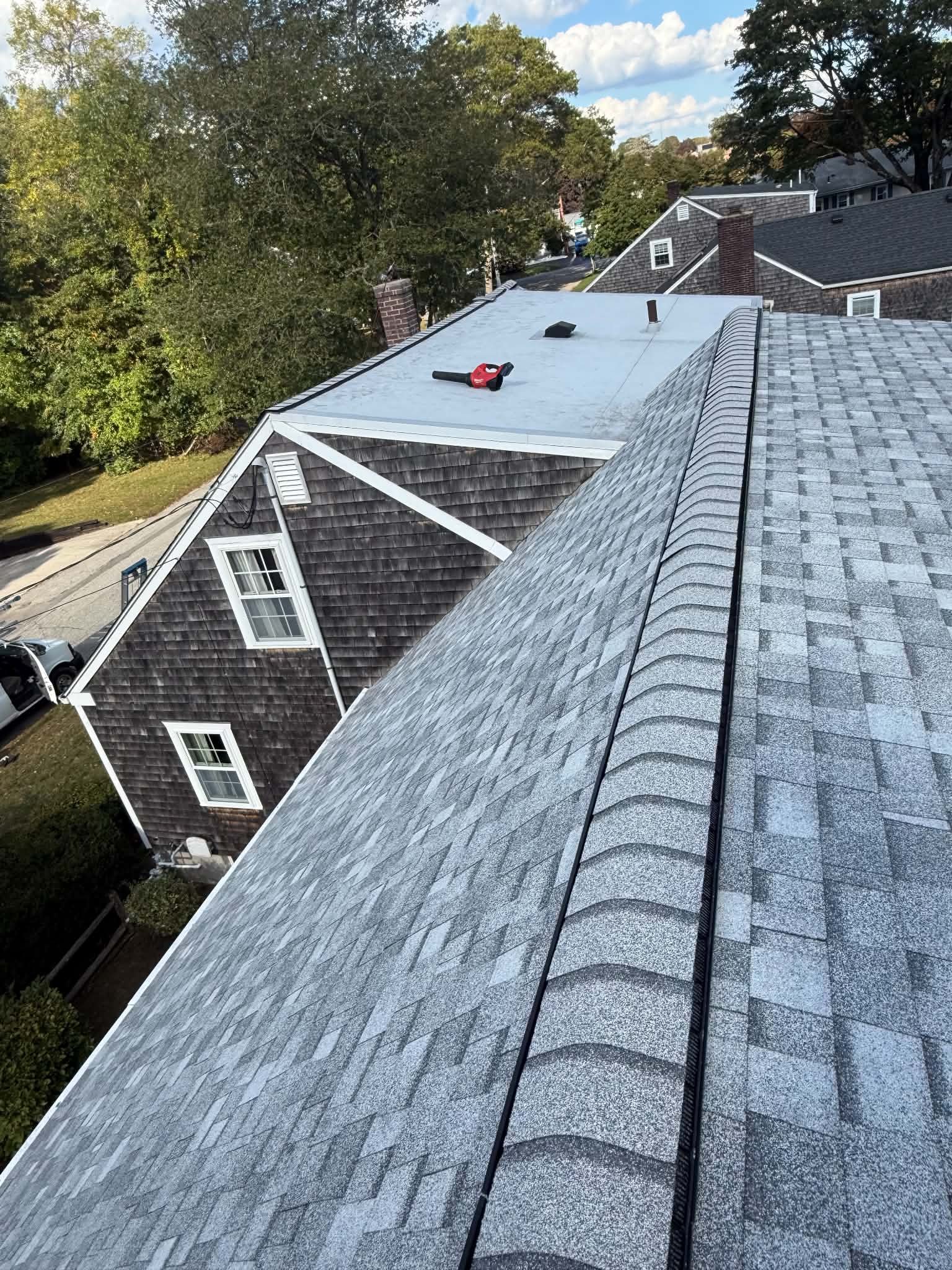 Projects New shingle roof with ridge vent on a Cape Cod style home in Massachusetts