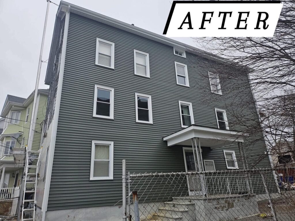 New vinyl siding on a multi-family home in Massachusetts, after photo