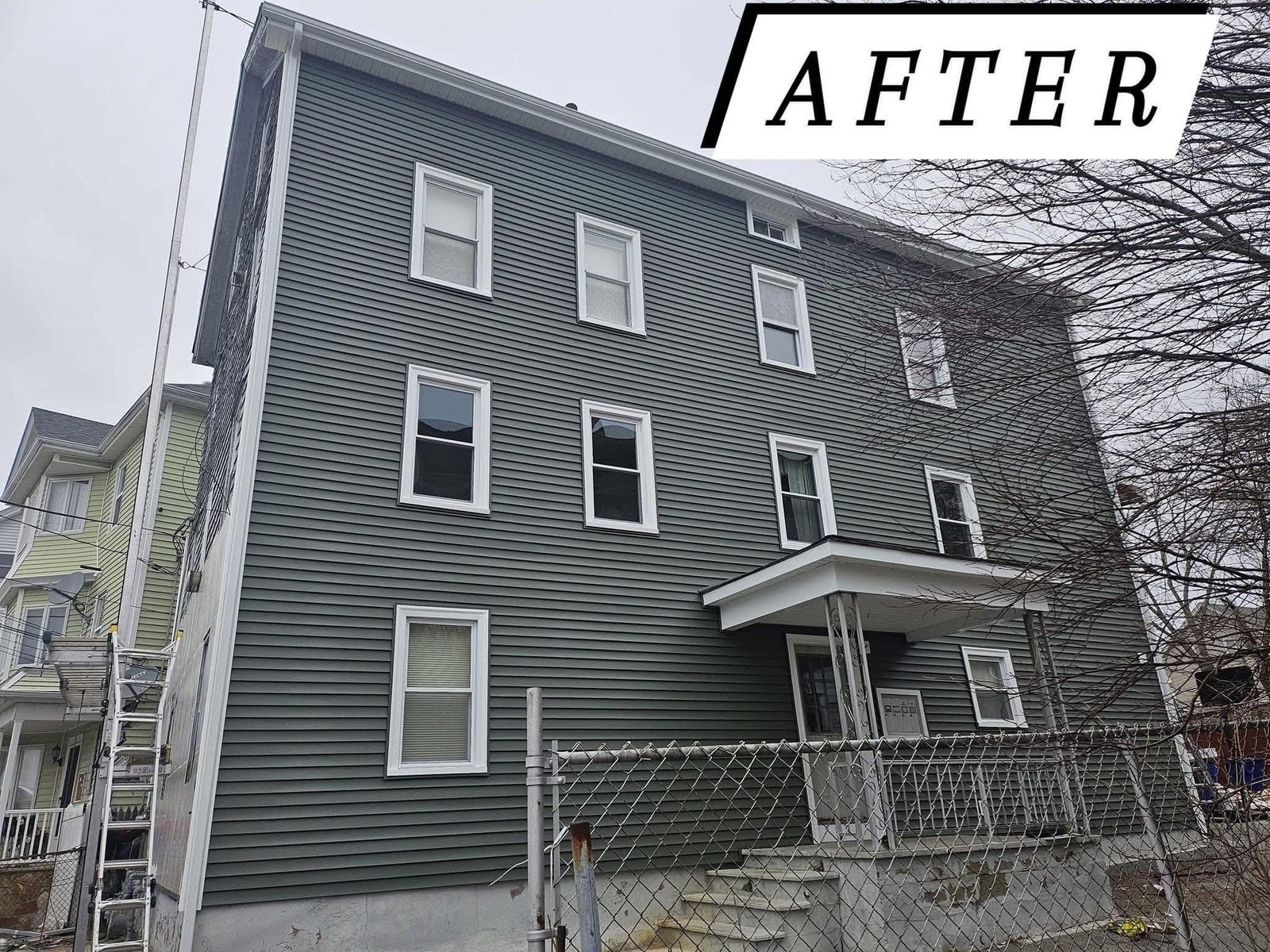 Projects New vinyl siding on a multi-family home in Massachusetts, after photo