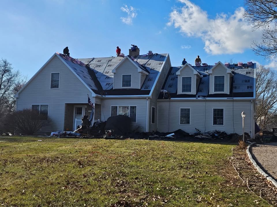 Projects New roof on a Cape style home with dormers in Massachusetts