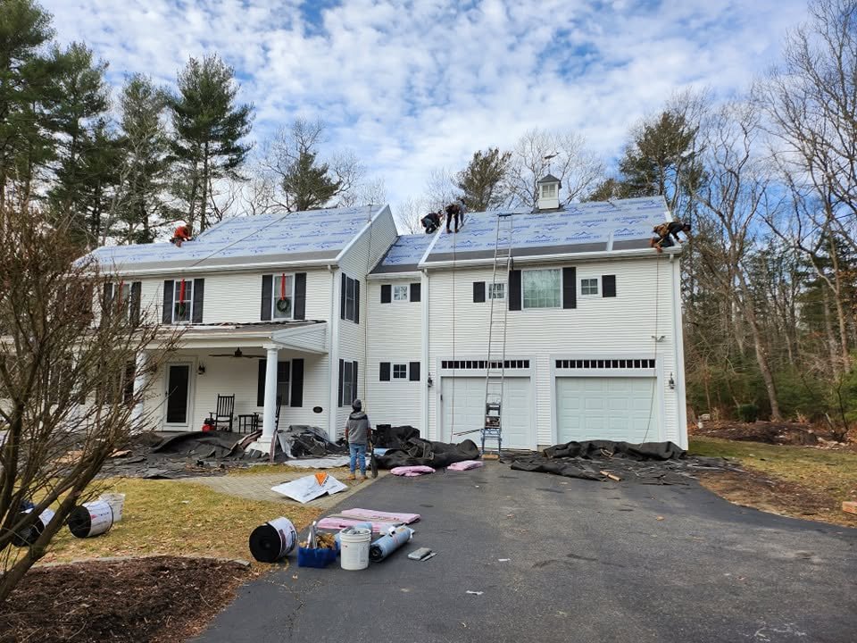 New roof on a white colonial home in Massachusetts