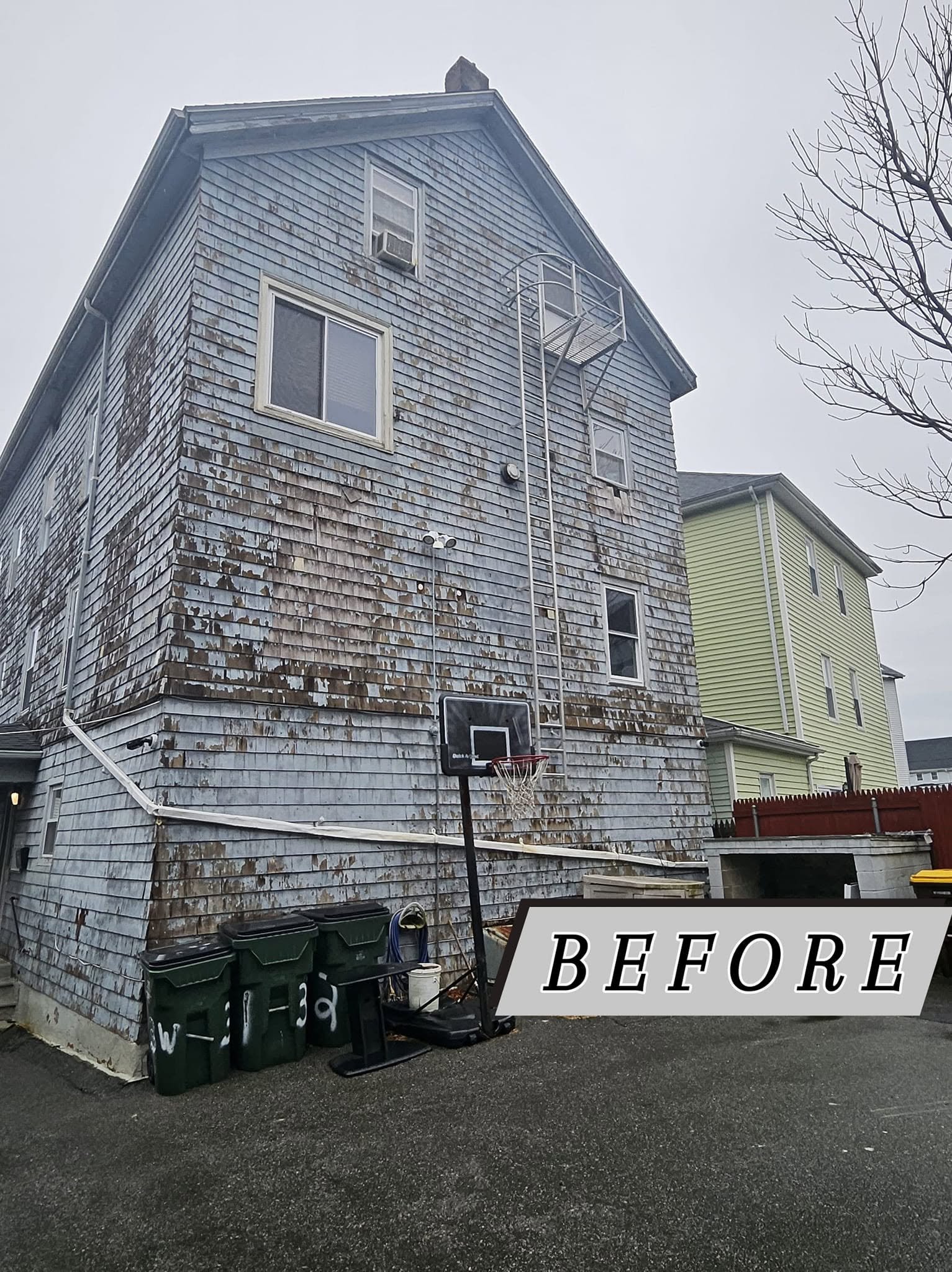 Projects Old siding before replacement on a multi-family home in Massachusetts